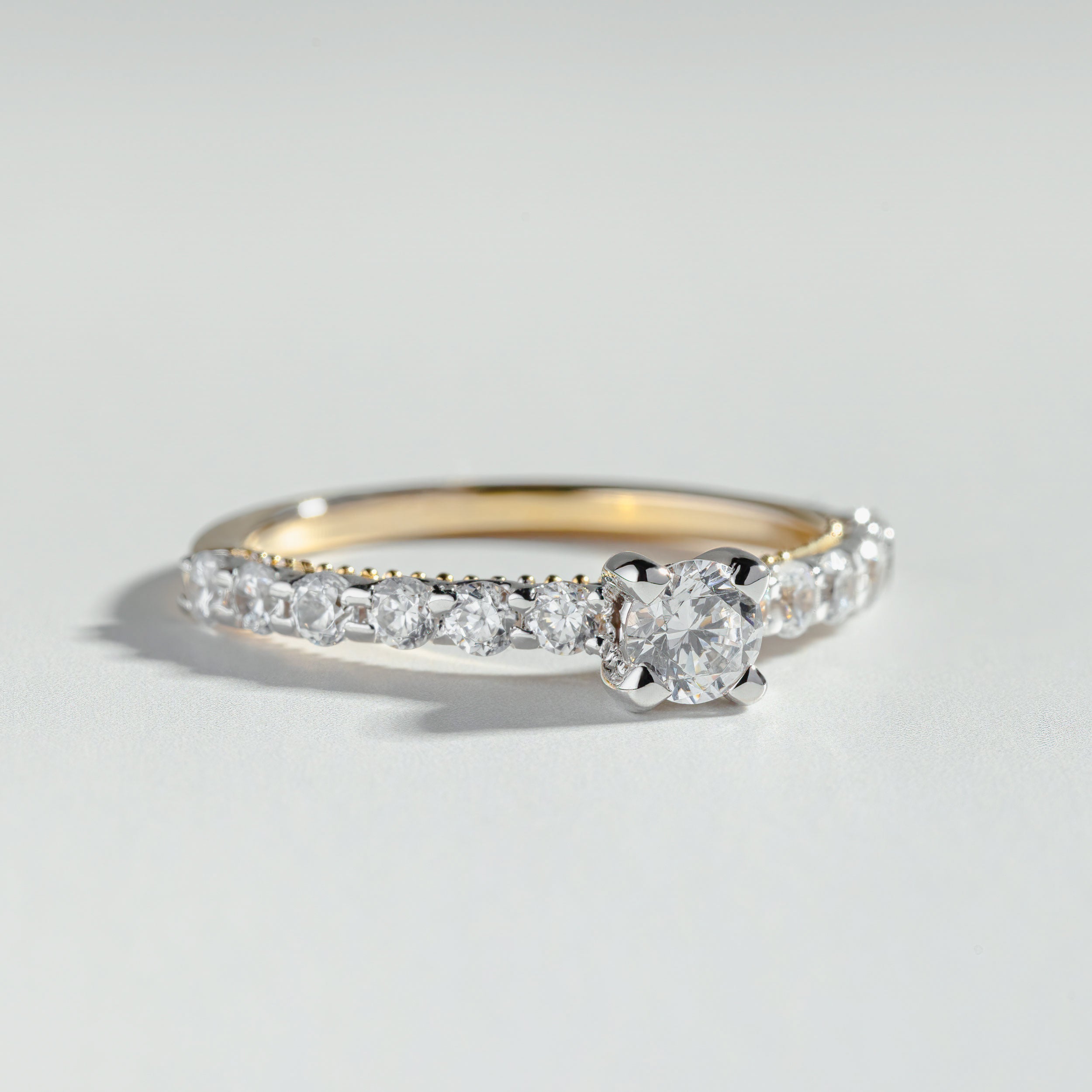 The Round Cut Shared Prong Pavé Ring by Atelier RMR Montreal