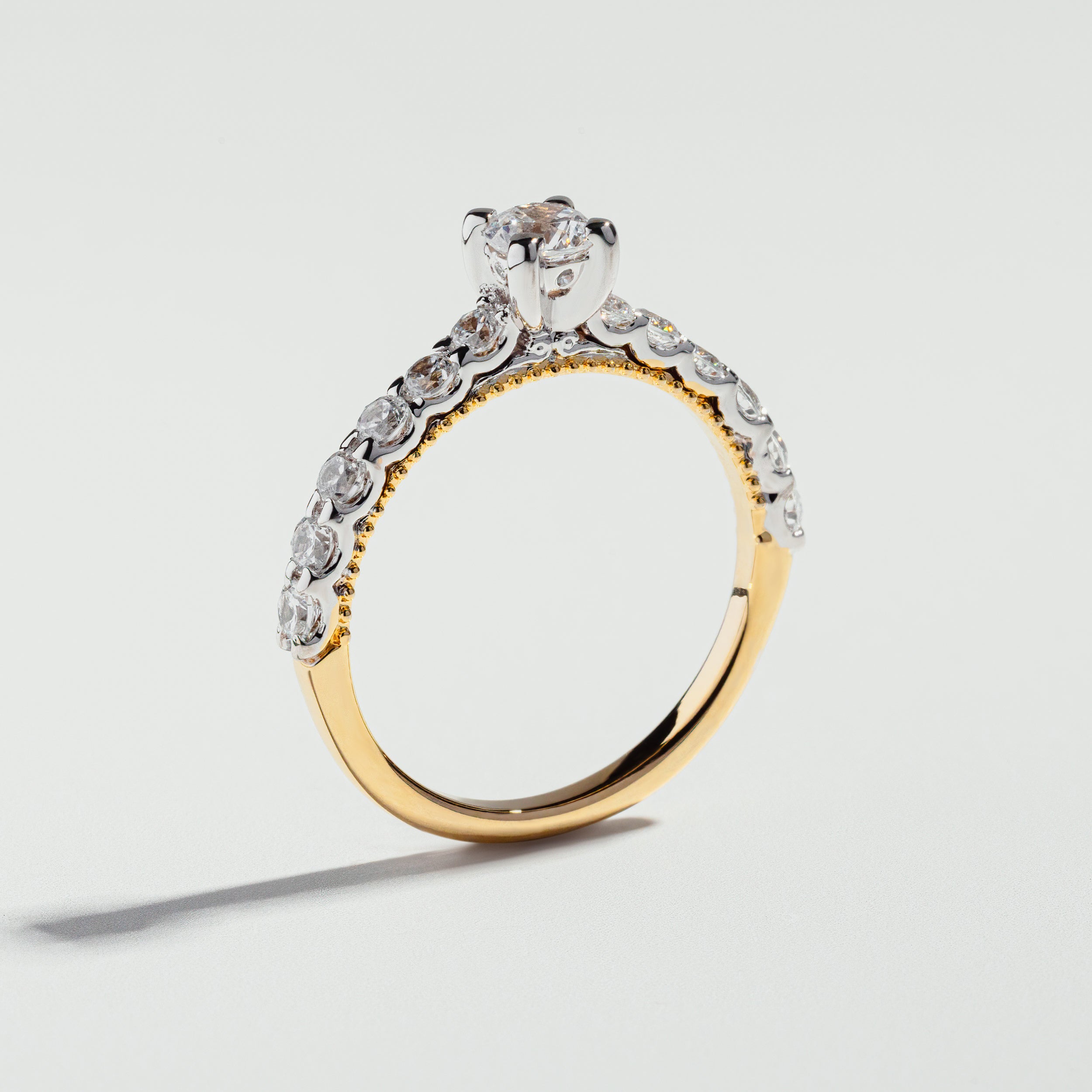The Round Cut Shared Prong Pavé Ring by Atelier RMR Montreal