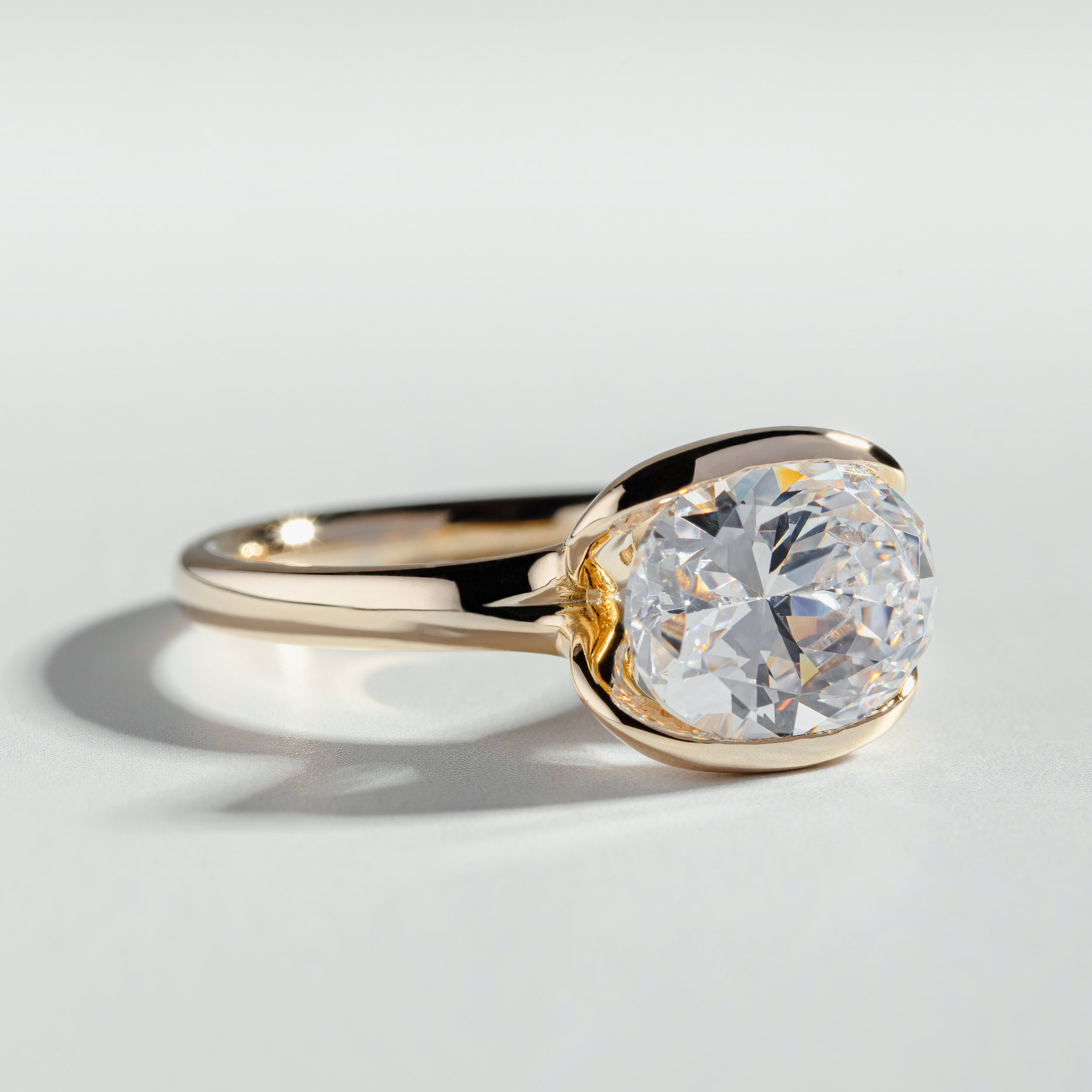 The Oval Cut Half Bezel Diamond Ring - Main Image