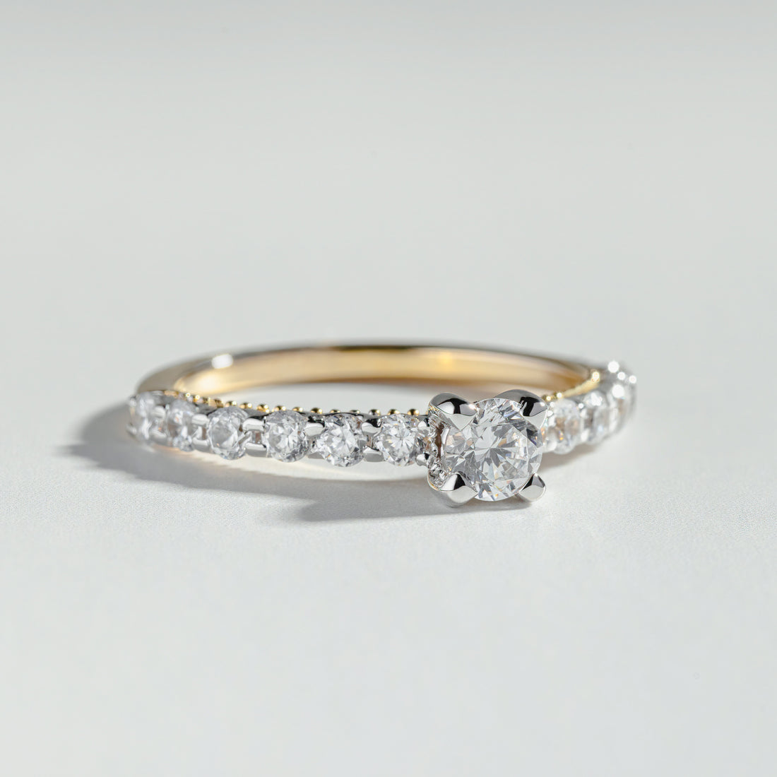 The Round Cut Shared Prong Pavé Ring