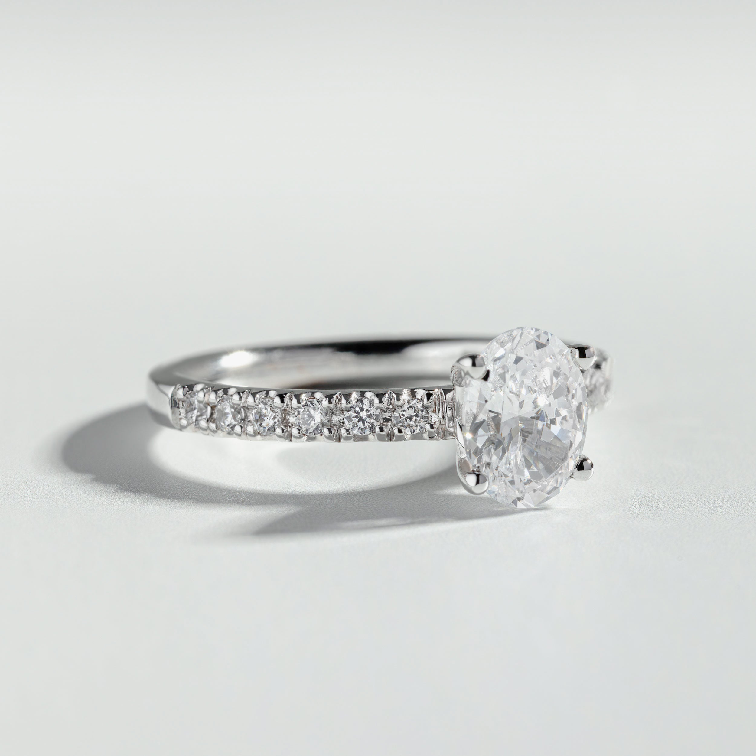 The Round Cut Pavé Solitaire Ring