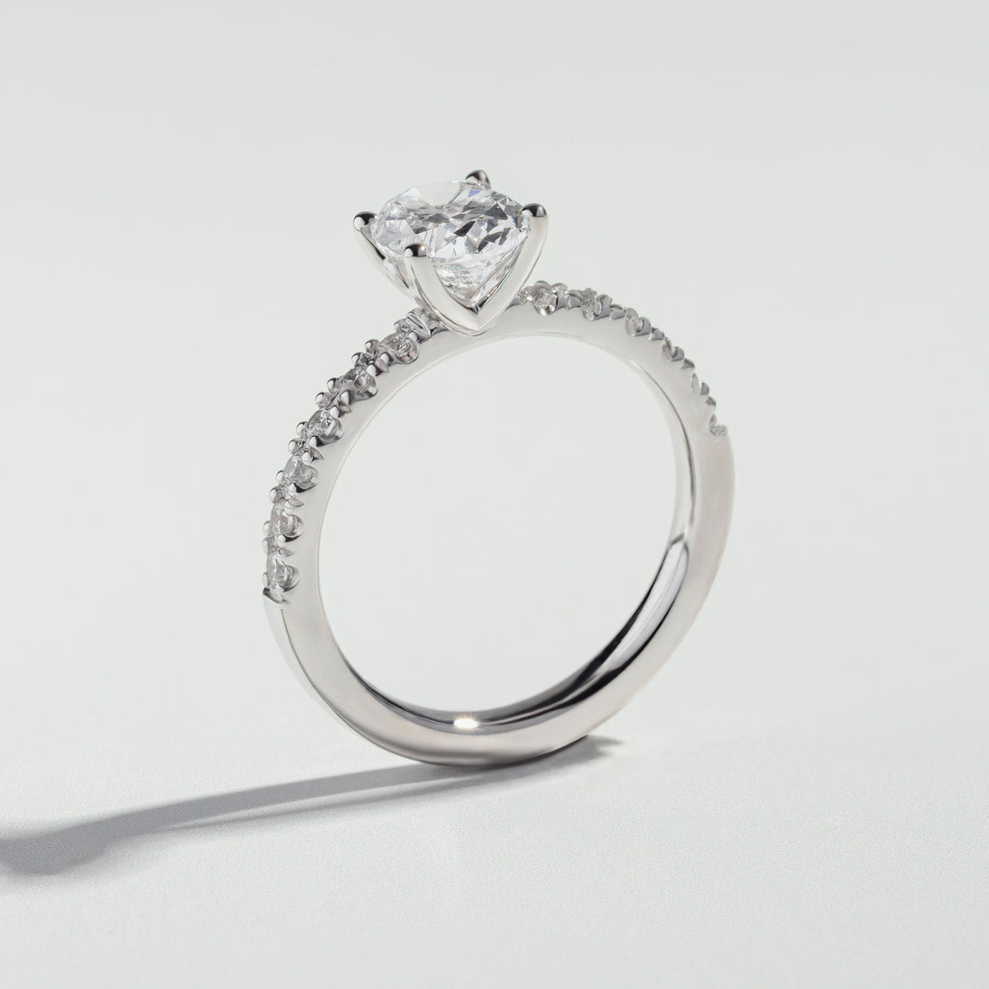 The Round Cut Pavé Solitaire Ring