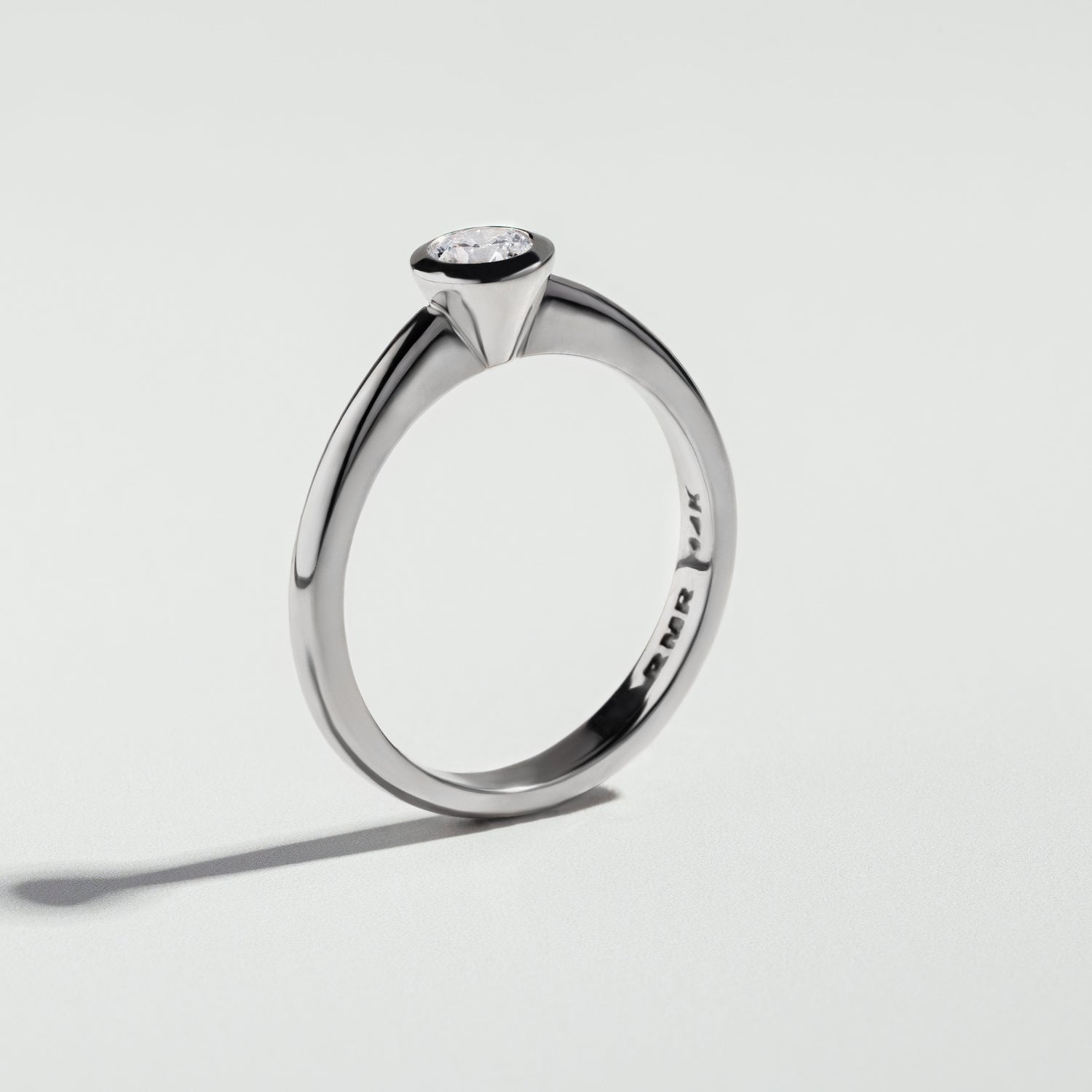 The Round Cut Bezel Diamond Ring