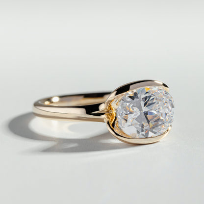 The Oval Cut Half Bezel Diamond Ring