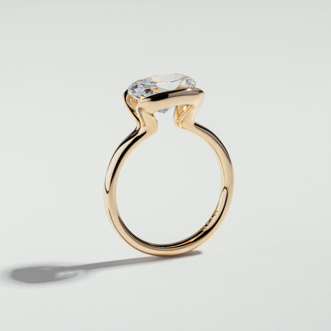 The Oval Cut Half Bezel Diamond Ring