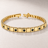 Bracelet TN03-4 en or jaune, diamants noirs, fond pierre greige — TN03-4 yellow gold bracelet with black diamonds on greige stone.
