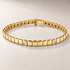 Bracelet TN03-4M en or jaune, diamants clairs, fond pierre greige — TN03-4M yellow gold bracelet with clear diamonds on greige stone.