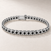 Bracelet TN03 en or blanc, diamants noirs, fond pierre greige — TN03 white gold bracelet with black diamonds on greige stone.