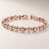 Bracelet TN18 en or rose, diamants clairs, fond pierre greige — TN18 rose gold bracelet with clear diamonds on greige stone.