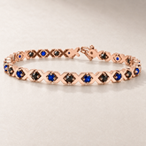 TN21S — Or rose / Rose gold — Saphirs bleus et diamants noirs / Blue sapphires and black diamonds — rendu illustratif / illustrative rendering