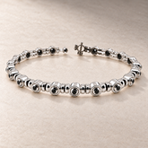 TN22 — Or blanc / White gold — Diamants noirs / Black diamonds
