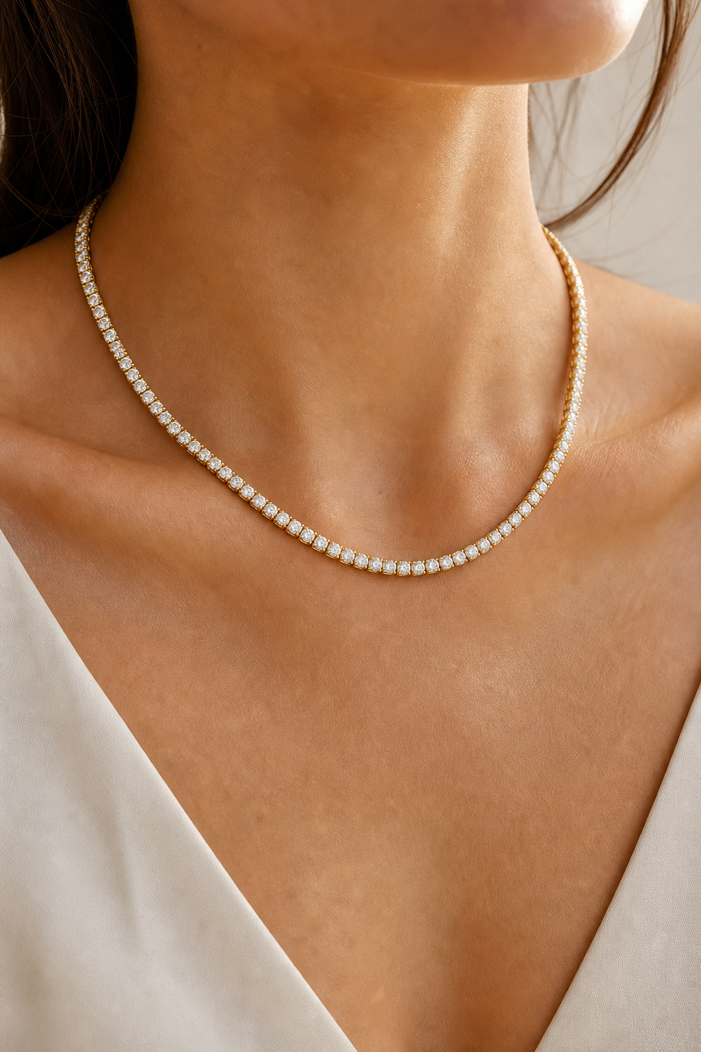 Diamond tennis necklace worn in 14K yellow gold