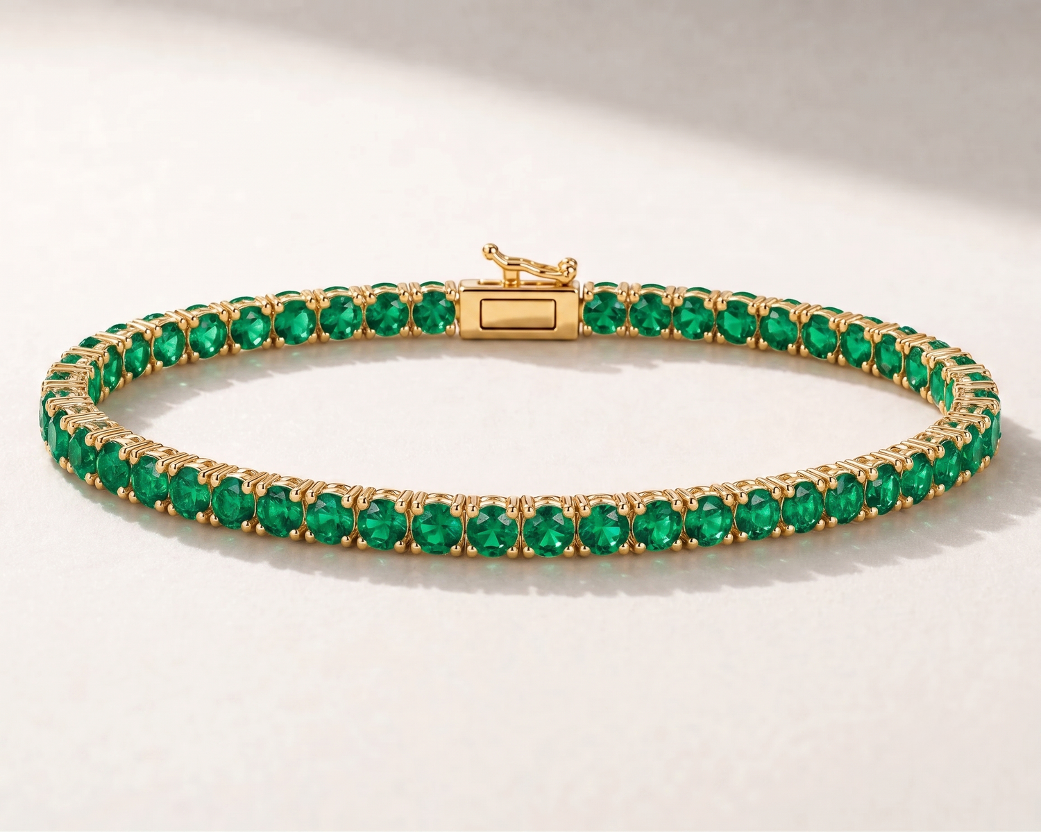 14K gold lab-grown emerald tennis bracelet