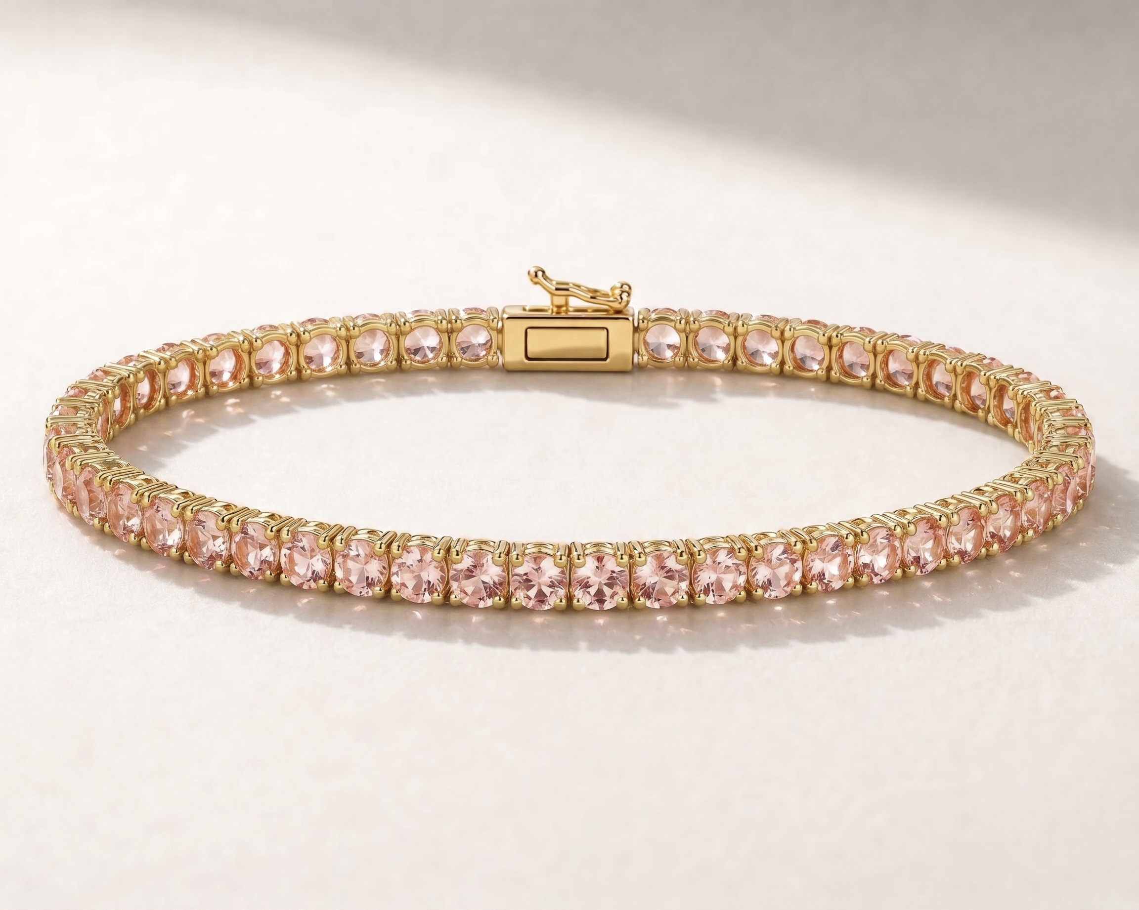 14K gold lab sapphire tennis bracelet in Pink Sapphire