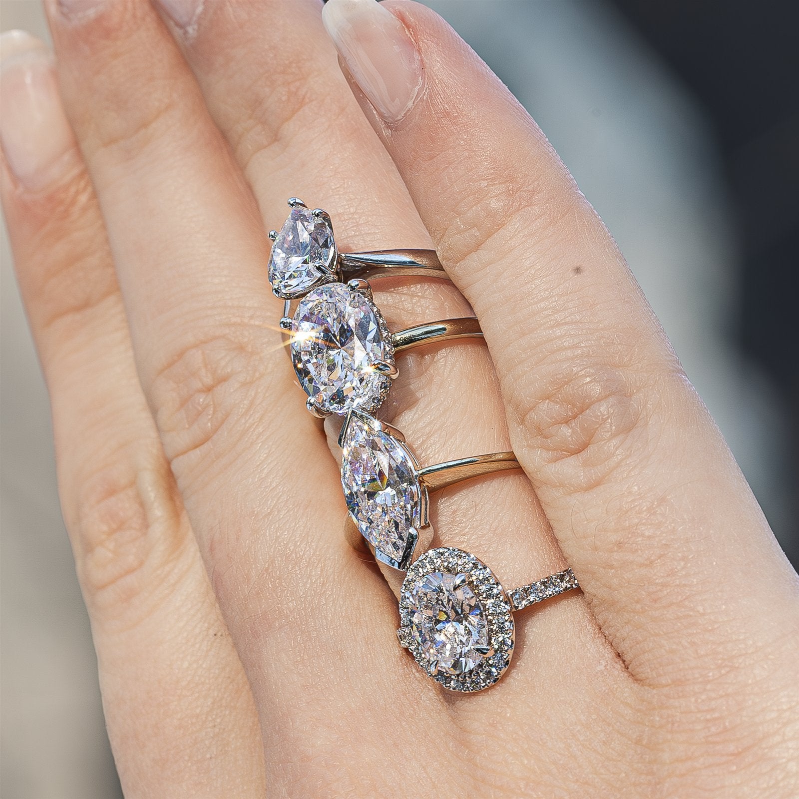 Comparison of oval, pear and marquise diamond shapes for engagement rings